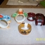 Round china ring with duck head & wing on top & feet to enable it to stand. 