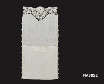 Cream linen oblong folded in half to form a pouch to contain a powder compact. 