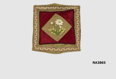 One Old Gold personal handkerchief sachet piped in burgundy cotton surrounded by floral braid. 