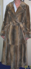c1970 Full length imitation fur coat with tie belt.