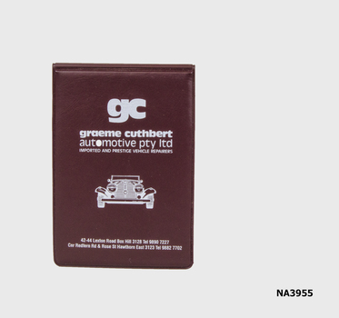 Brown plastic booklet with information about what to do after an accident.