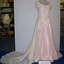 Cream lace dress and train overlaying pink satin with attached cream taffeta half slip