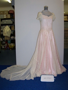 Cream lace dress and train overlaying pink satin with attached cream taffeta half slip