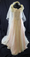 Cream lace dress and train overlaying pink satin with attached cream taffeta half slip with full length cream veil