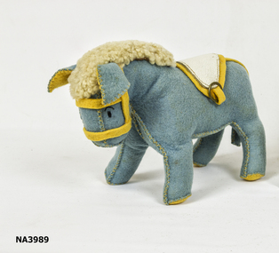Blue felt toy donkey with cream leather saddle and yellow felt bridle