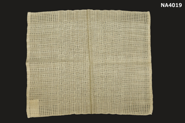 Cream cotton hand woven place mat.