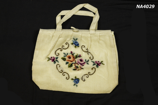 Cream open weave knitting bag.