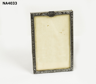 Metal photo frame with wooden back. 