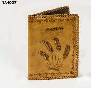Light tan leather photo holder.  All edges are thonged with light tan leather thonging. 