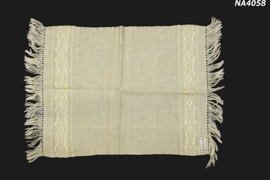Cream hand woven with self embroidery  at each end and fringe.