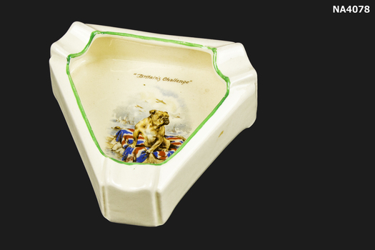 Triangle shaped cream crockery ash tray. 