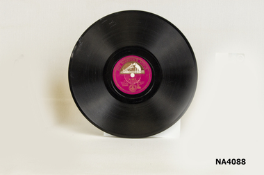 Flat, round Bakelite record. 