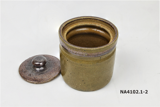 Tan ceramic jar with lid. 