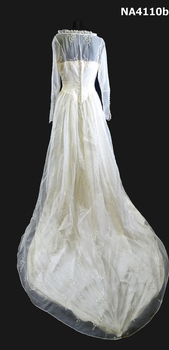 1958 Cream embroidered Nylon wedding dress. Fitted long sleeves to a point at waist, fastened with thirteen self covered buttons. 