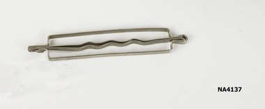 Rectangular metal hair roller clip with hair pin type to fit into this.