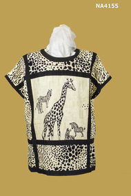 1980's Cream blouse. Zebra and giraffe printed in black on cotton. Black trim down each side and across middle.