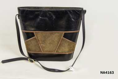 Handbag black leather with brown suede inserts on the front, edged with very thin stripes of brown leather. 