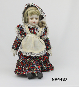 Porcelain head, hands, & half leg. Doll, shoes & socks painted, also painted face.