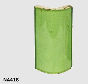  Glazed rounded tile.