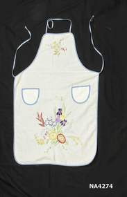 Cream cotton apron bound with blue bias binding.