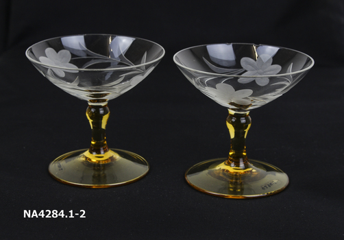  Etched plain glass bowls amber base and stems. 