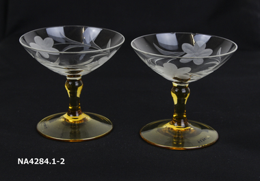  Etched plain glass bowls amber base and stems. 