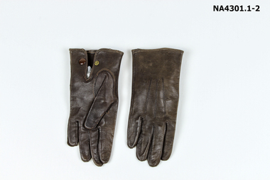 Pair of child's gloves - brown - suitable for a child about eight years old. 