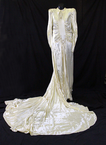 1945 Cream satin  wedding dress with a rouched bodice to a centre panel, high neckline and pointed collar