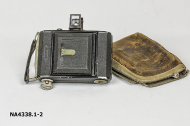 Small black oblong camera with fold down view finder and fold out bellows