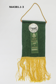 Green felt pennant with a badge of 'Friends of the Lake' attached. 