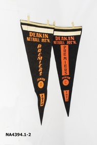 Two black and orange triangular banners.
