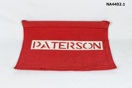 Red School house banners on wooden support with cord attached for hanging. 