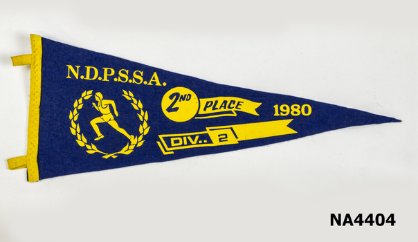 Triangular blue felt school pennant. Gold printing NDPSSA. Drawing of sprinter with laurel wreath around it in gold.