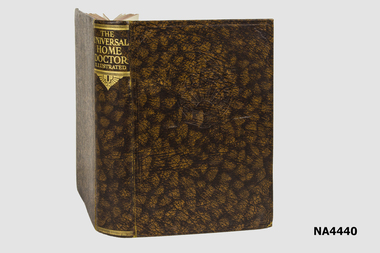 Brown artificial leather covered book with gold lettering on the spine and an embossed emblem on the cover.
