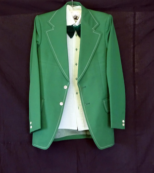 Single breasted jacket with two pearl buttons centre and smaller buttons on sleeves