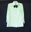 Shirt is a polyester fine knit, pale green with dark green buttons. 