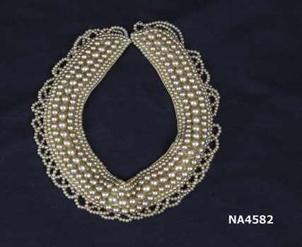 Pearl Collar. Intricate pattern made of small and large cream Coloured pearls.