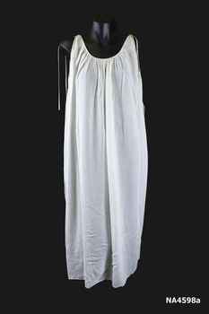 1966 white sleeveless batiste nightgown with salmon pink silk Rouleau ties on shoulders. (front)
