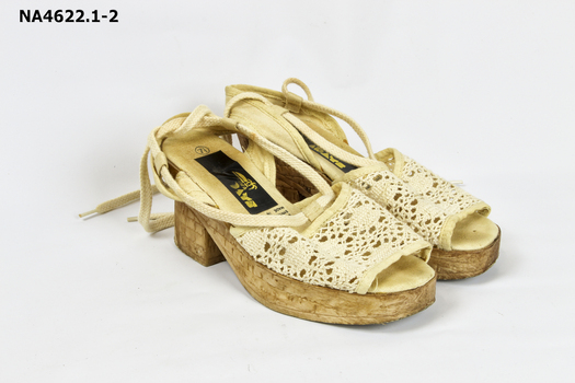 Beige coloured 3cm plastic platform sandals.