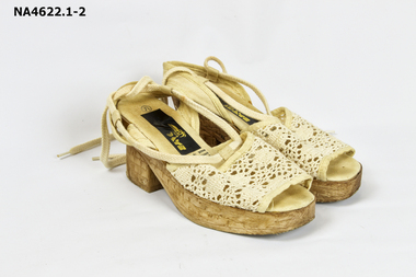 Beige coloured 3cm plastic platform sandals.