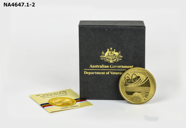 Round gold coloured medallion
