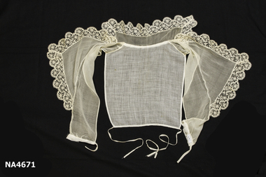 Cream Georgette and voile revere collar trimmed with cream chemical lace. 