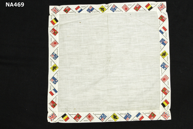 Linen handkerchief with flags of various countries printed on border.