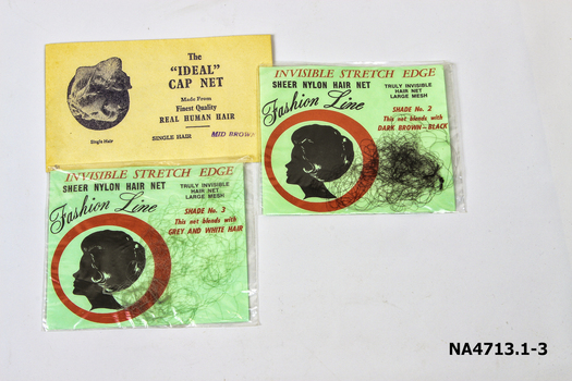 Three hair nets in their original packets. 
