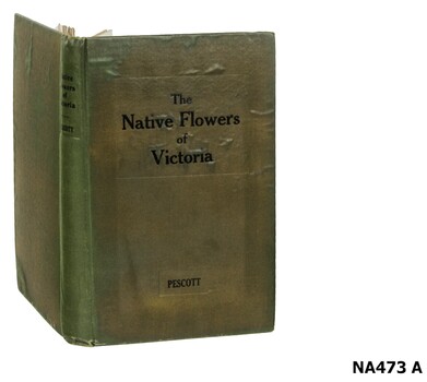 Green covered book on Victorian native flowers