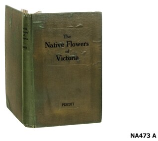 Green covered book on Victorian native flowers