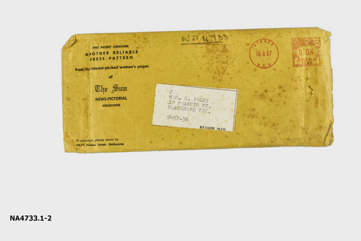 Brown envelope containing dress pattern.