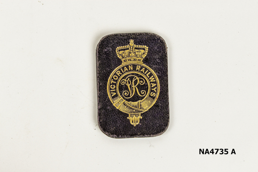 Small leather folder containing Victorian Railways station to station ticket 