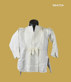 Boy's white voile dress shirt with turn down collar, placket opening at front to pleat. 