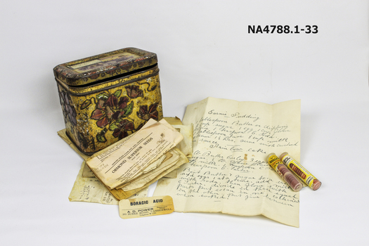 A tin containing hand written recipes